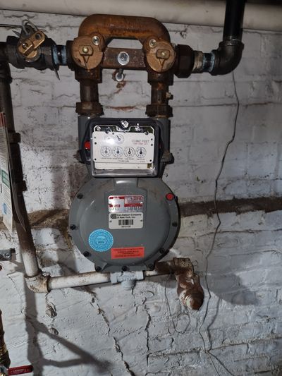 Copper supply piping and gas meter — utility upgrade.
